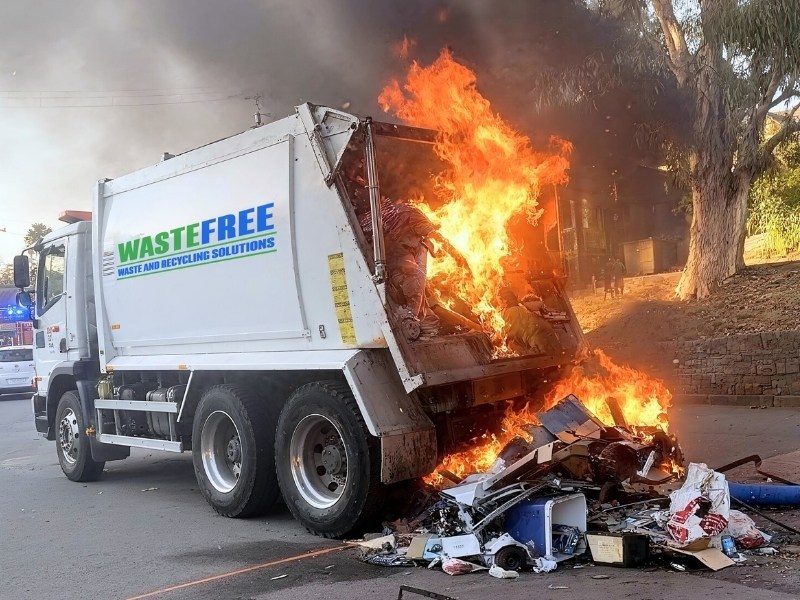 Waste collection truck fire caused by lithium-ion batteries highlighting safety risks in commercial waste handling and disposal systems