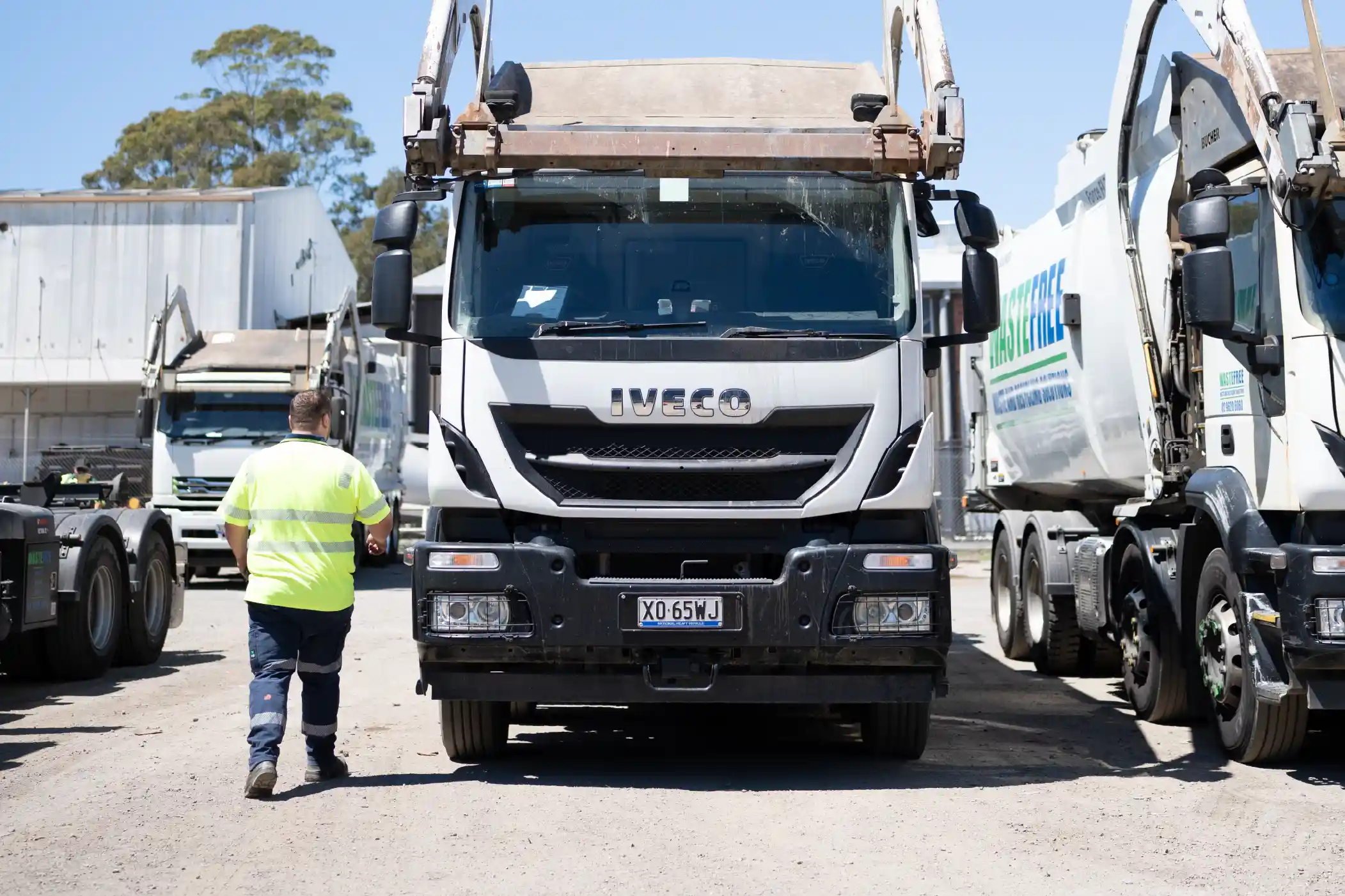 Front lift waste collection trucks supporting commingled recycling collection services for commercial and industrial waste management