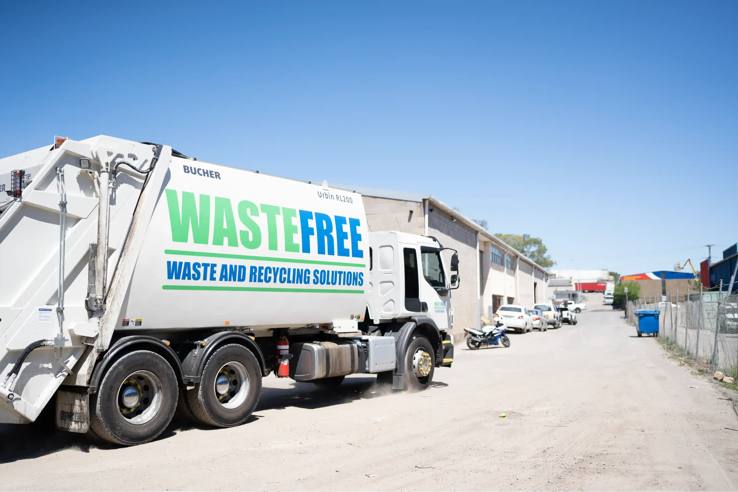 wastefree rear lift truck servicing commercial waste collection route in nsw industrial area for efficient recycling and waste management