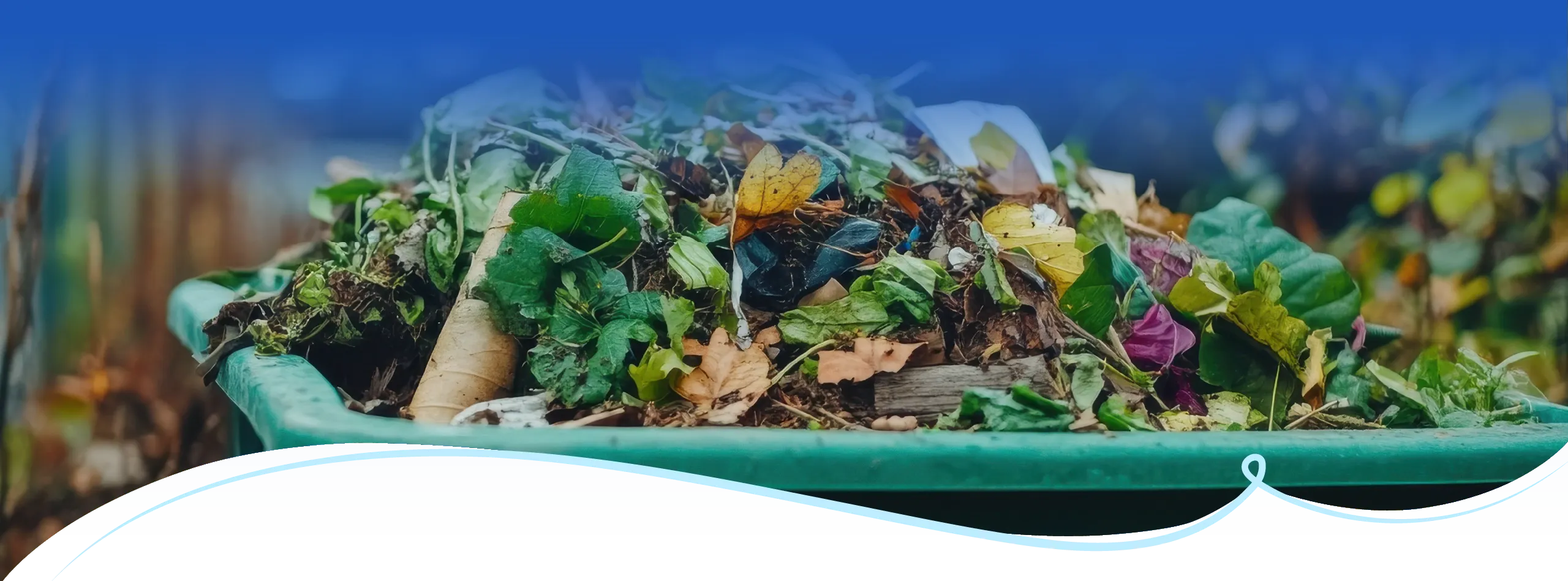 Green waste materials including leaves and organic debris in collection bin for commercial recycling services Sydney