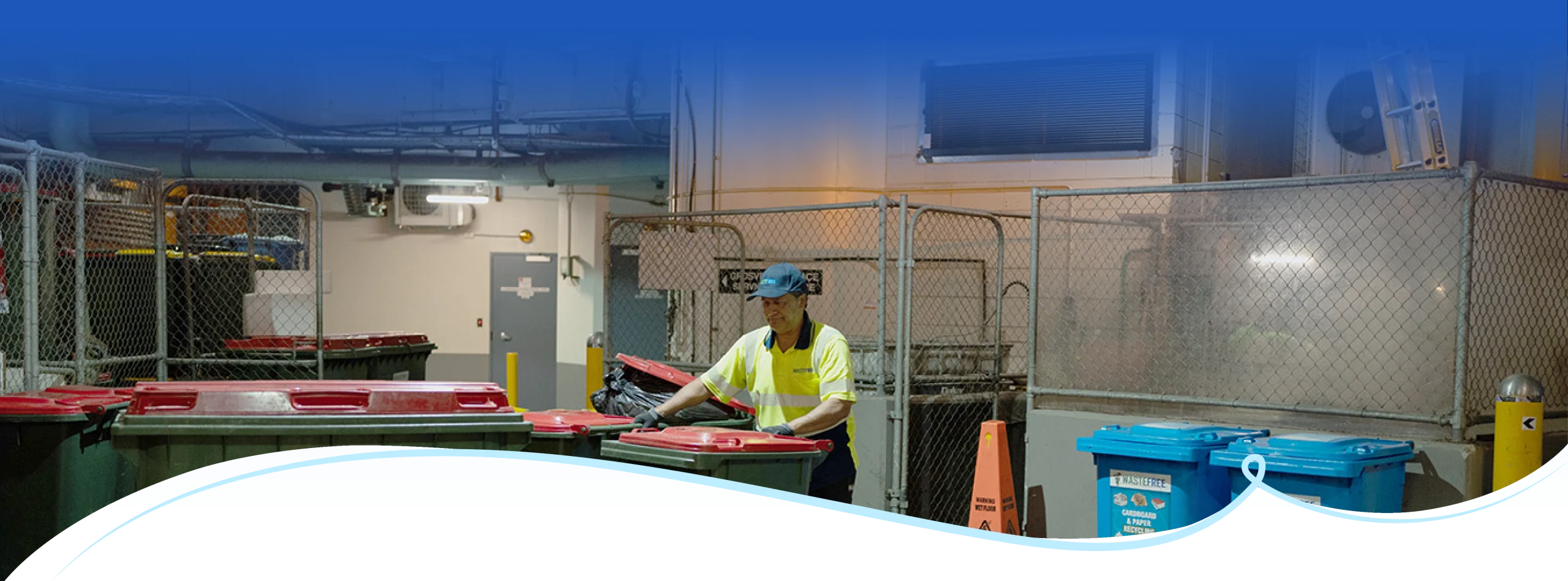 Commercial waste collection bins and operator handling general waste for industrial waste management services in Sydney